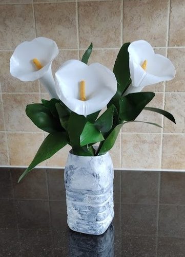 CD, arum lilies, sculpture, recycled plastic milk bottles, & acrylic.